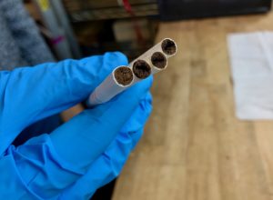 Heated tobacco (darker area) can be seen in the center of the three used heat sticks on the right. The heat stick on the left is unused. (Credit: Indoor Environment Group/Berkeley Lab)