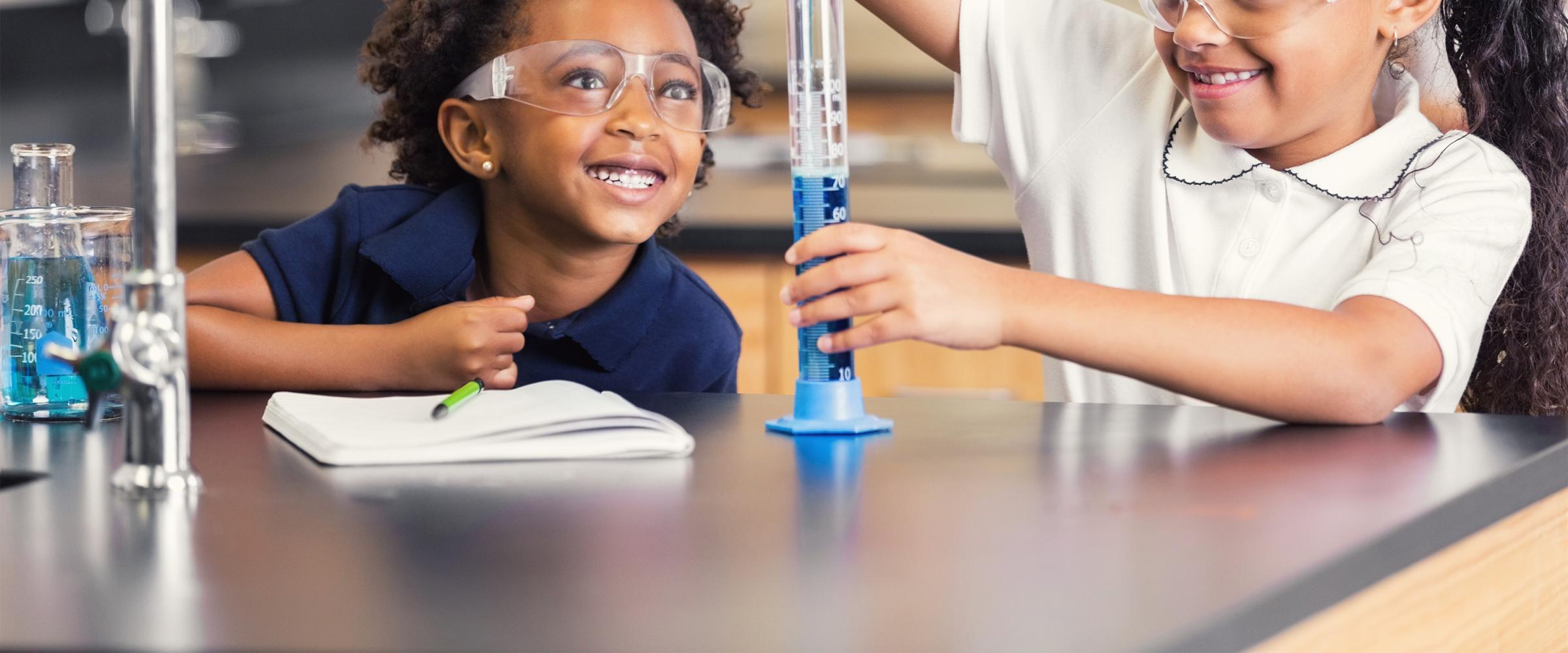 Two students work on a science experiment in the classroom. Credit: iStock