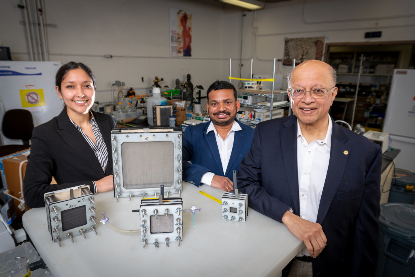  (Left to Right) Dana Hernandez, Siva Bandaru, and Ashok Gadgil with the arsenic filters they developed. (Credit: Thor Swift/Berkeley Lab)